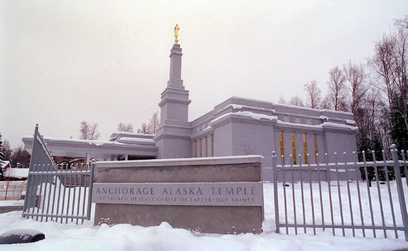 The front sign of the Anchorage Alaska Temple, with the temple in the background.