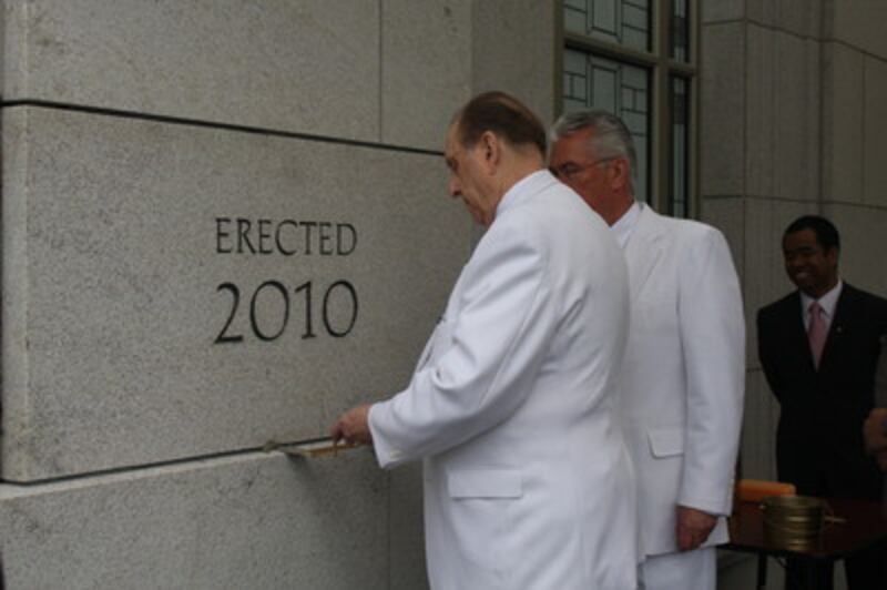 President Dieter F. Uchtdorf watches as President Thomas S. Monson applies mortar to the Vancouver B