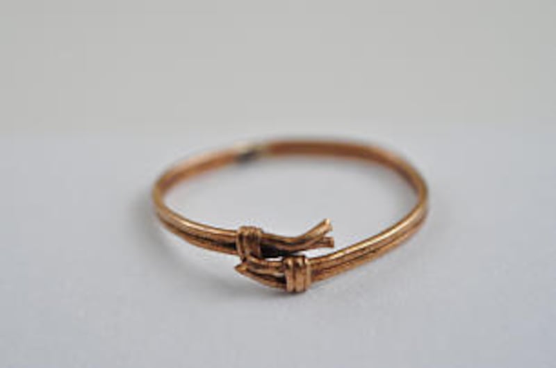 This gold ring, tarnished by the ages, was found at the excavation site. Visitors who came by to see