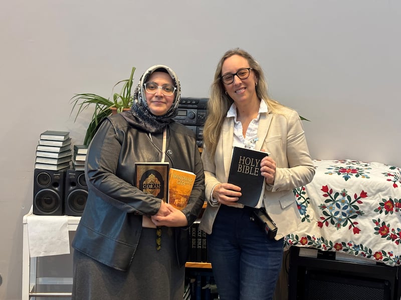 Chaplain Esra Aksu, left, and Chaplain Becky Mantynen hold religious materials available to women at Grand Valley Institution for Women.