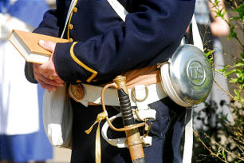 This man wears a uniform, canteen and sword similar to original members of the Mormon Battalion.