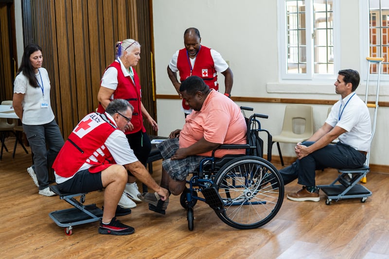 Volunteers help fit a wheelchair that was donated by The Church of Jesus Christ of Latter-day Saints as part of a larger donation of hundreds of wheelchairs in Bolivia in 2026.