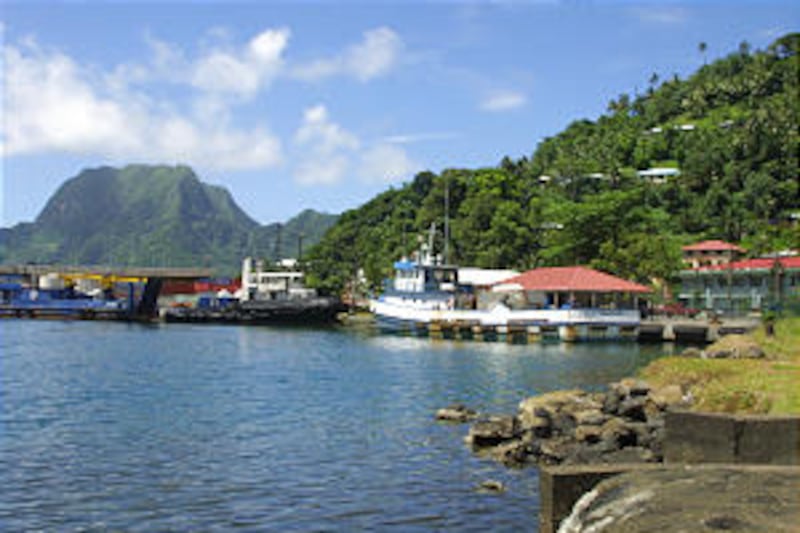Fishing ships dock in the busy Pago Pago Harbor on the island of Tutuila. A collapsed volcanic calde