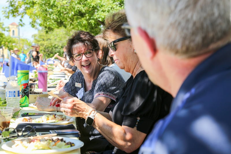 Sharon Brost, Just Serve Specialist for the Denver North Stake, speaks with friends at a community event on Saturday, July 26, 2025, in Denver, Colorado.