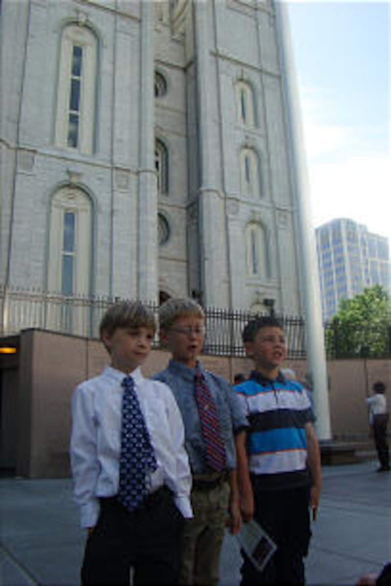 A trio of young campers enjoy a Sabbath-day visit to Temple Square. The day included a special sacra