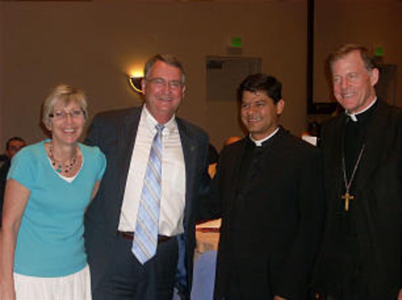 Debbie and Lyman Hafen, Utah South Area Public Affairs Council, visit with the Rev. Gustavo Vidal, S