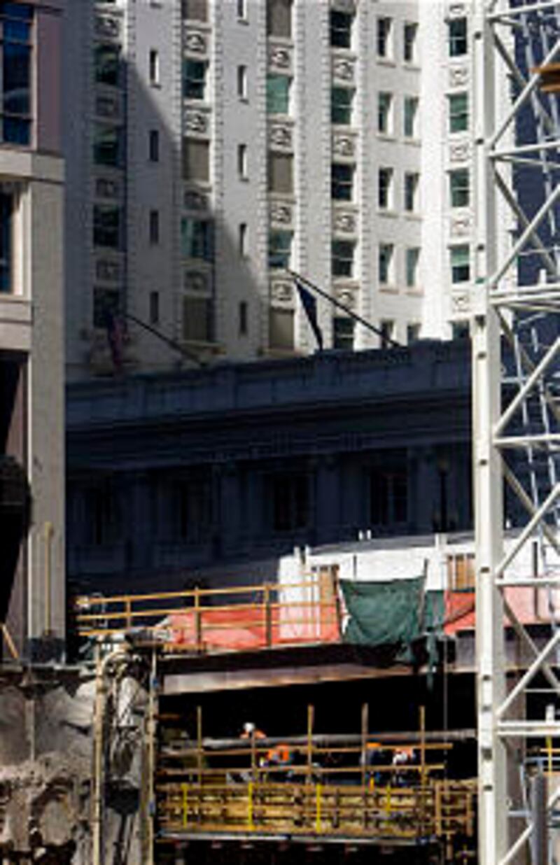 Workers can be seen underneath South Temple in front of the Joseph Smith Memorial Building from the
