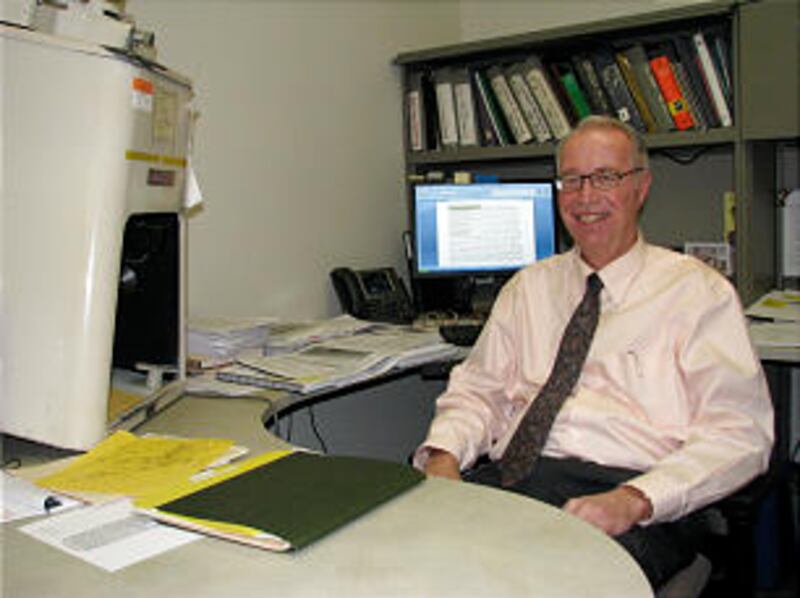 Mel Bashore, Church History Library historian, is shown in his office where he uses a vintage microf
