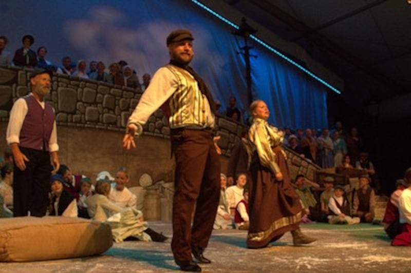 Seth Wilkins, center, plays role of Twizzleton Turley; at right, Rachel Pratt depicts his wife, Marg