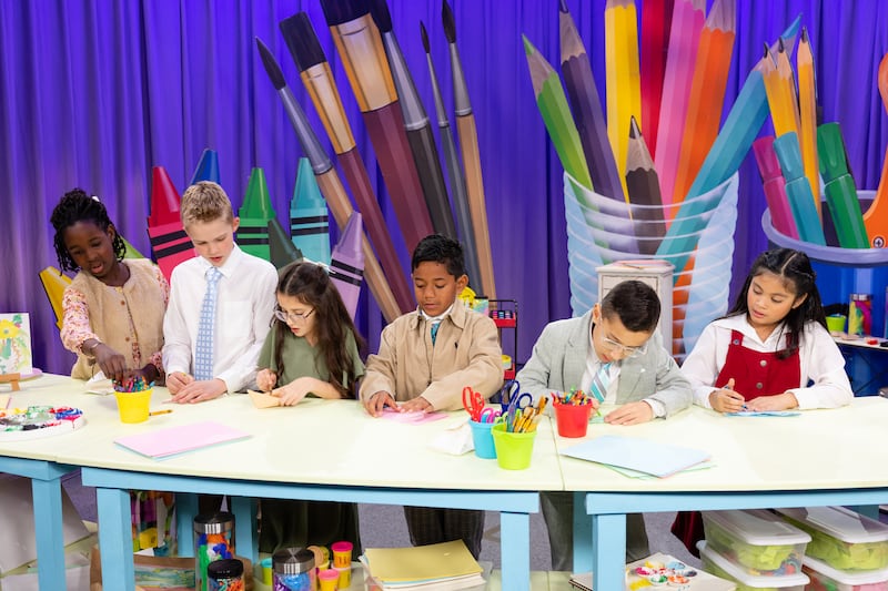 Children fold paper to make an origami Noah's ark during the filming of a Friend to Friend video available on Sunday, May 24, 2026.