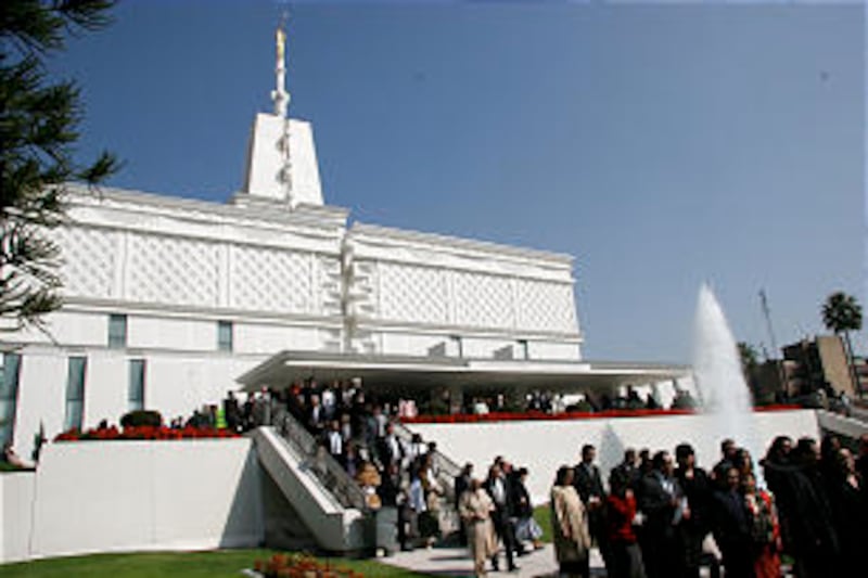 Beneath sunny skies, members file out of the Mexico City Mexico Temple on Nov. 16, 2008, following t