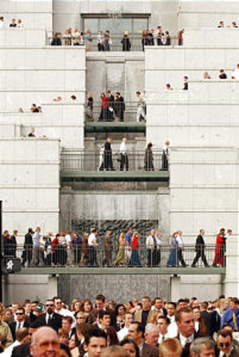 Conference attendees leav the conference center after LDS General Conference Oct 5th, 2002. Allred/