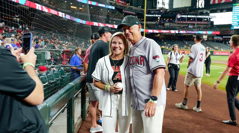 Elder Michael A. Dunn, General Authority Seventy, right, interacts with baseball fans at an Arizona Diamondbacks game in Phoenix, Arizona, on Monday, July 20, 2026.