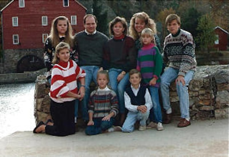 Paul and Bonnie Oscarson and their children pose for Christmas card photograph, taking in 1988 on th