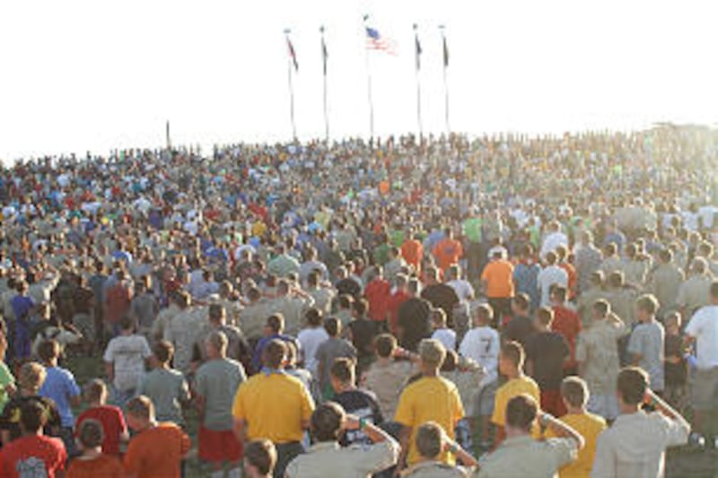 Thousands of Scouts and their leaders honor the flag during a June 27 evening event at the 2013 Rise