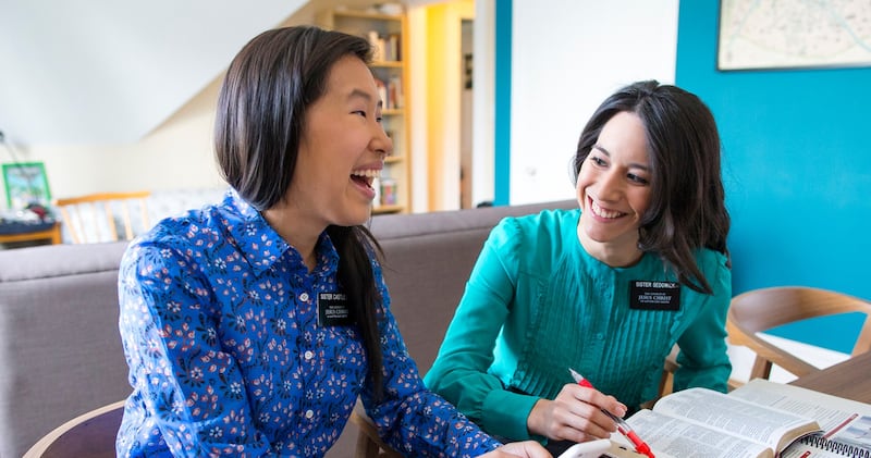 A companionship of sister missionaries studies together in 2023.