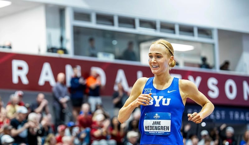 BYU's Jane Hedengren smiles as she wins the 5,000-meter race at the NCAA Indoor Track and Field Championships.