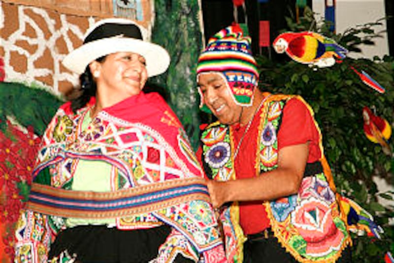 Guillermo Carbajal and his sister, Rita Johnson, perform the Peruvian dance known as the Huaylarsh.